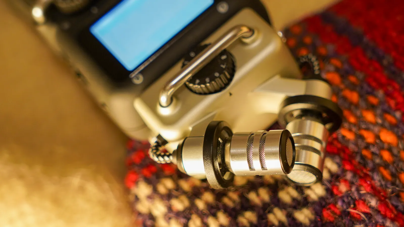 A portable field recorder with its stereo microphones